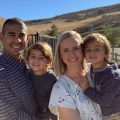 Smiling family in sunny landscape