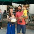 Happy family holding two kids
